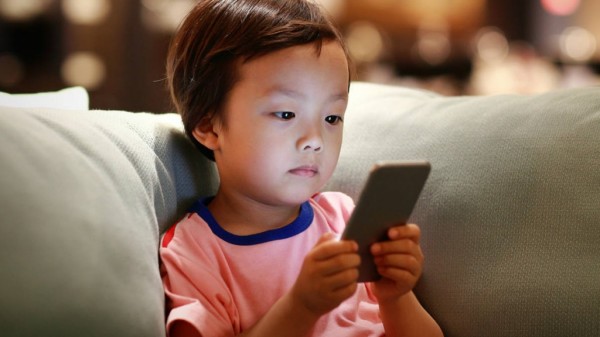 little-boy-looking-at-phone-on-couch-1024x576-1515610949.jpg